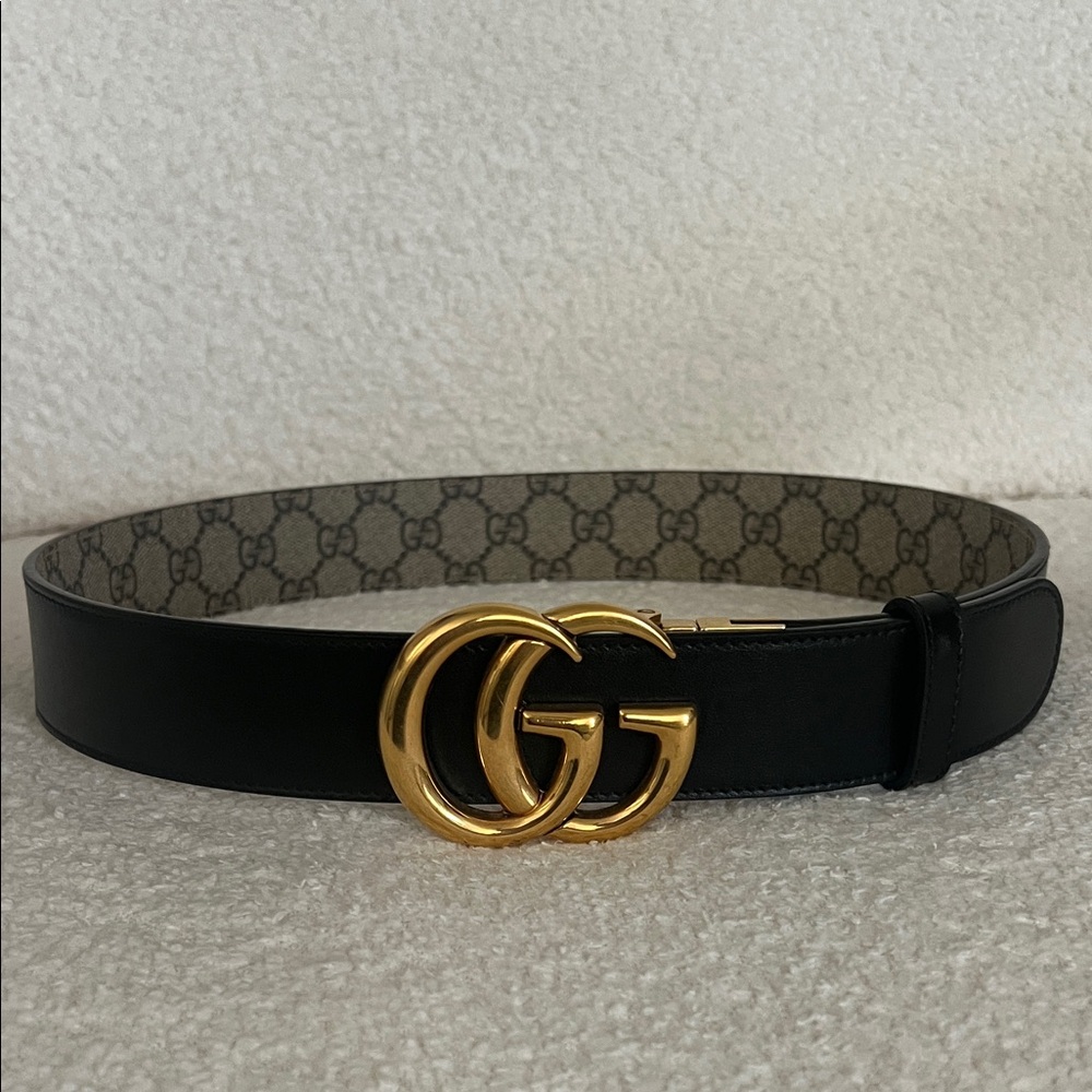 Gucci reversible Black and brown monogram belt with Gold GG Buckle